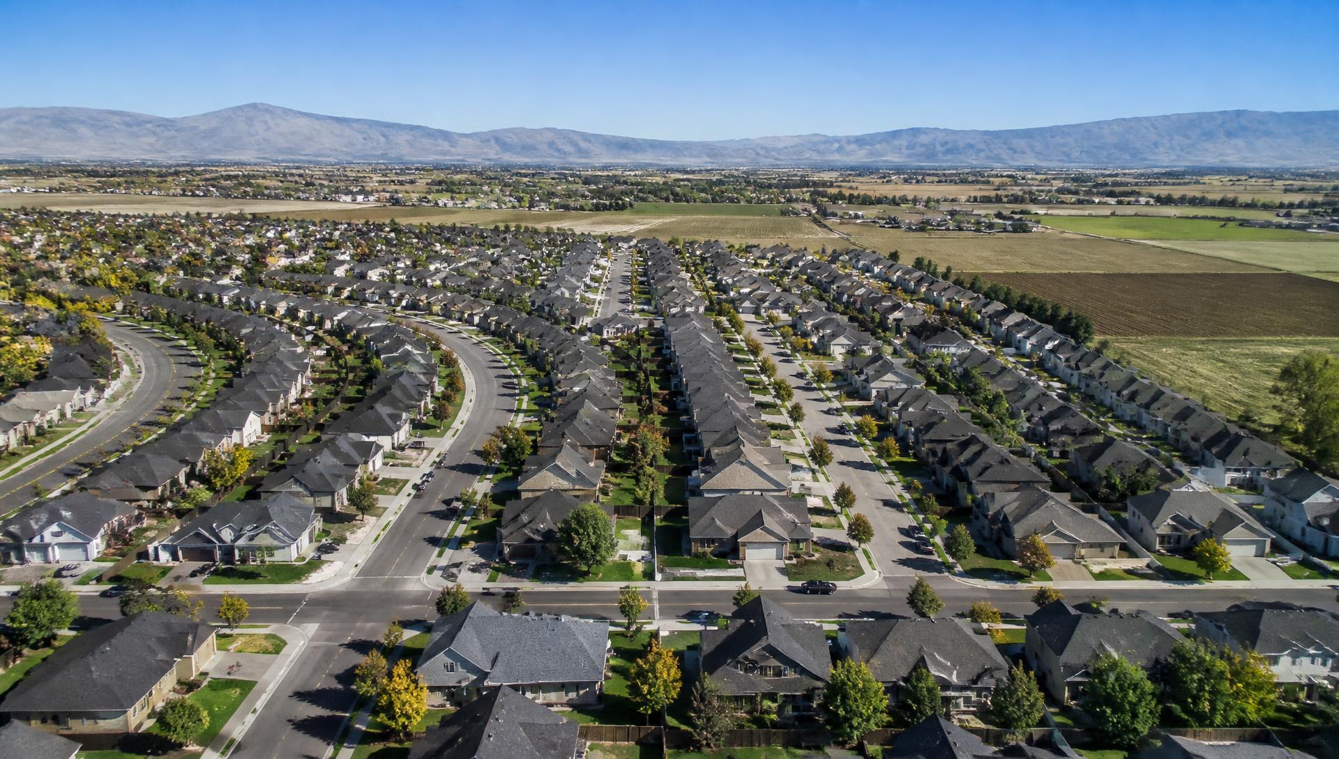Treasure Valley rooftops with the Idaho foothills behind them